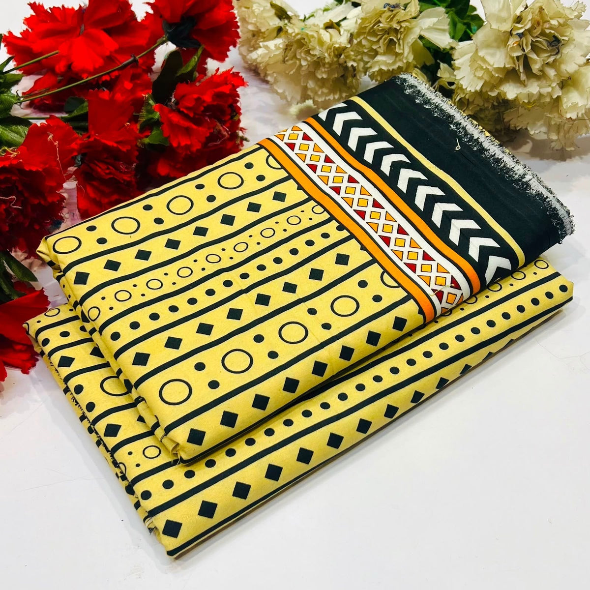 2 piece suit in yellow with black geometric patterns